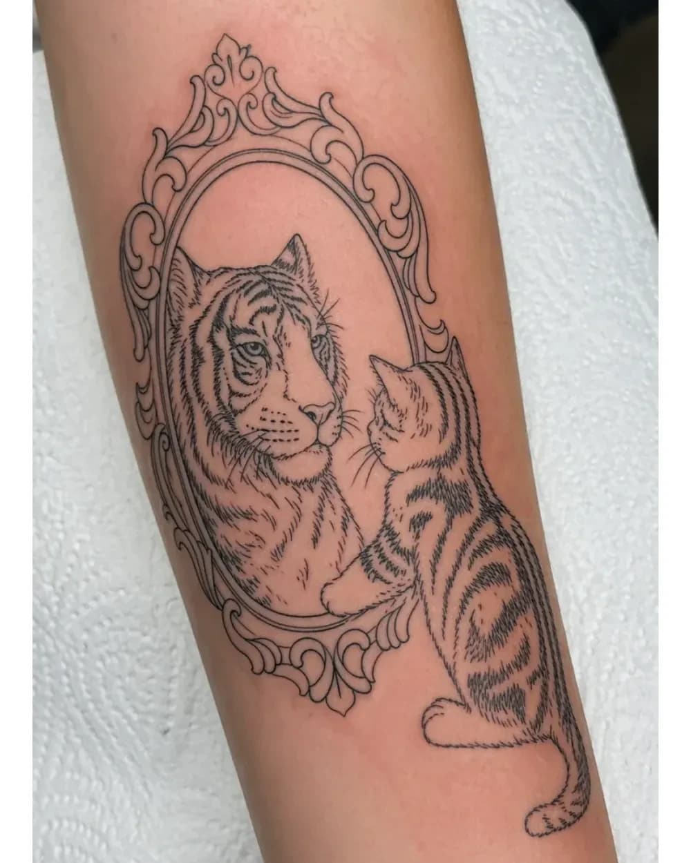 Animal tattoo stencil example featuring a mirrored tiger and kitten composition